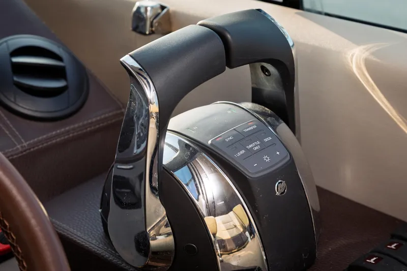 Slide: The Image of Close-up of 2015 Regal 53 Sport Coupe throttle control in cockpit. - 42