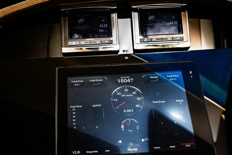 Slide: The Image of Dashboard of a 2015 Regal 53 Sport Coupe displaying fuel and speed metrics. - 43