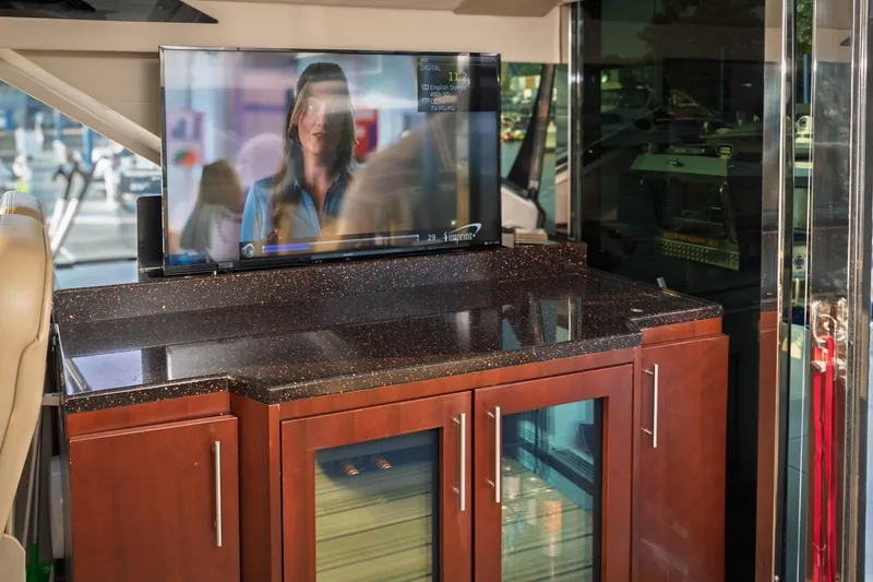 Slide: The Image of Interior of 2015 Regal 53 Sport Coupe with TV and sleek cabinetry. - 49