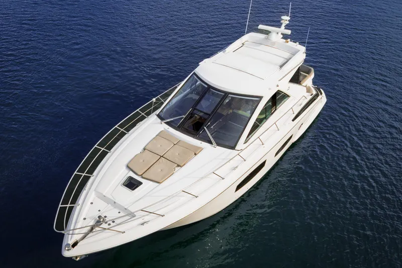 Slide: The Image of 2015 Regal 53 Sport Coupe yacht on calm blue water, aerial view. - 5
