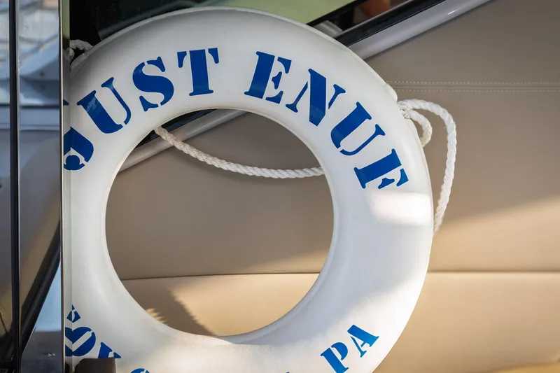 Slide: The Image of Lifebuoy on 2015 Regal 53 Sport Coupe with "Just Enuf" text. - 50
