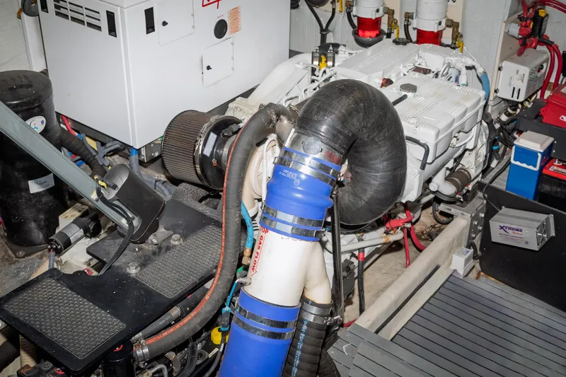 Slide: The Image of Engine room of a 2015 Regal 53 Sport Coupe with visible components and wiring. - 59