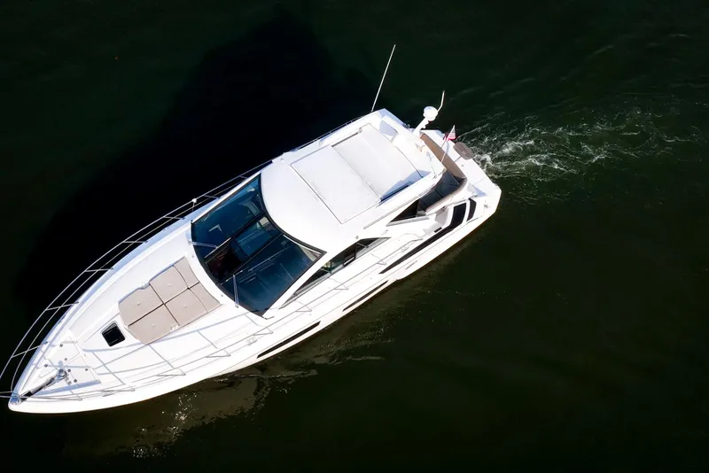 Slide: The Image of Aerial view of 2015 Regal 53 Sport Coupe yacht cruising on water. - 8