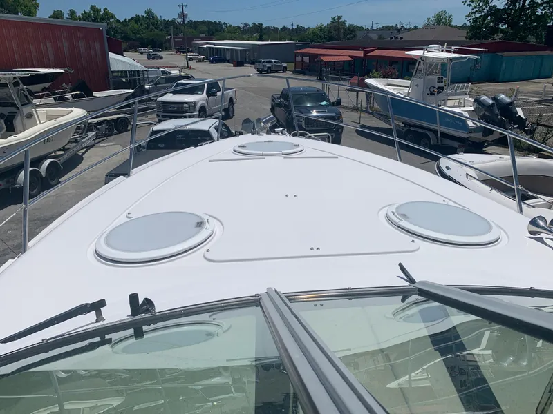 Slide: The Image of 2007 Four Winns 318 Vista boat deck view at a marina. - 10