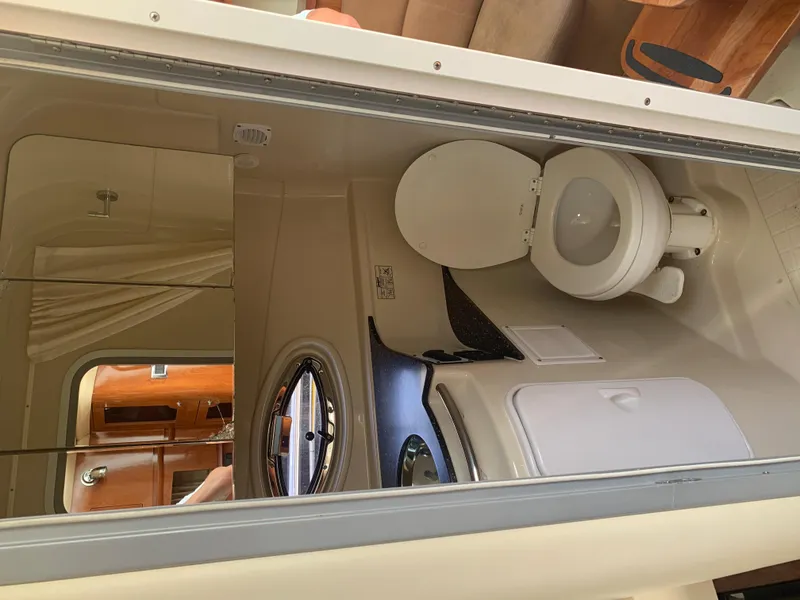 Slide: The Image of 2007 Four Winns 318 Vista boat bathroom with toilet and sink. - 12
