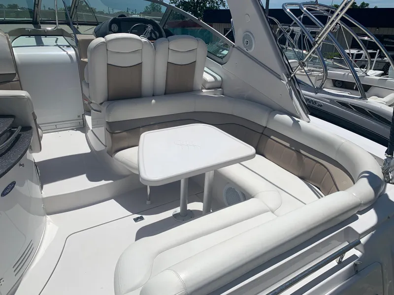 Slide: The Image of 2007 Four Winns 318 Vista boat interior with white seating and table. - 4