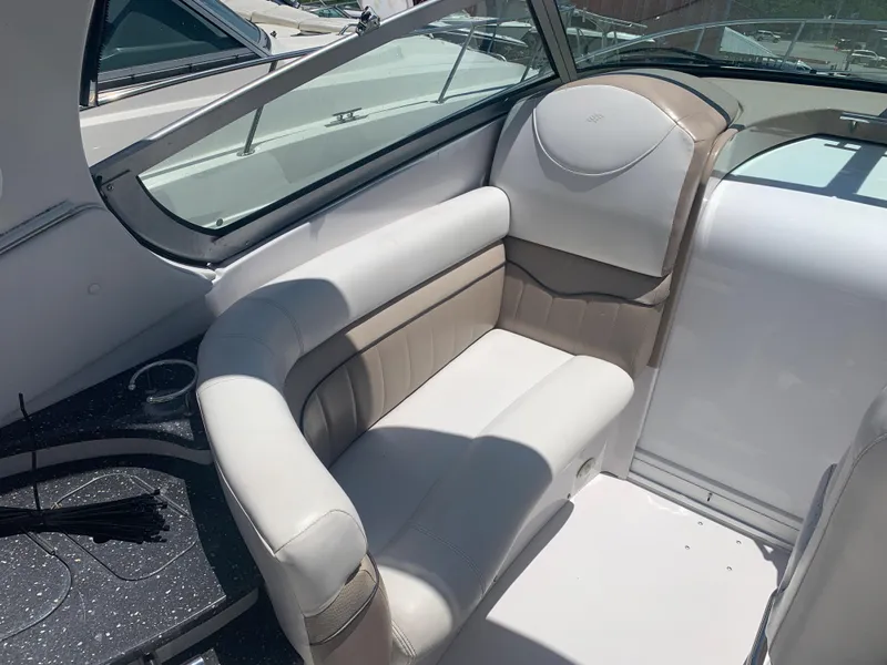 Slide: The Image of 2007 Four Winns 318 Vista boat interior seating area with white and beige upholstery. - 6