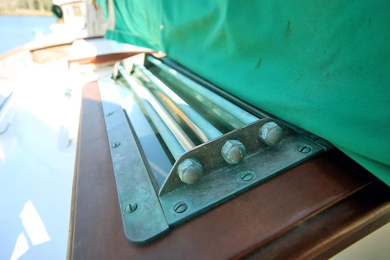 Slide: The Image of Close-up of 1979 Custom Van Dyne Schooner deck hardware with green cover. - 11