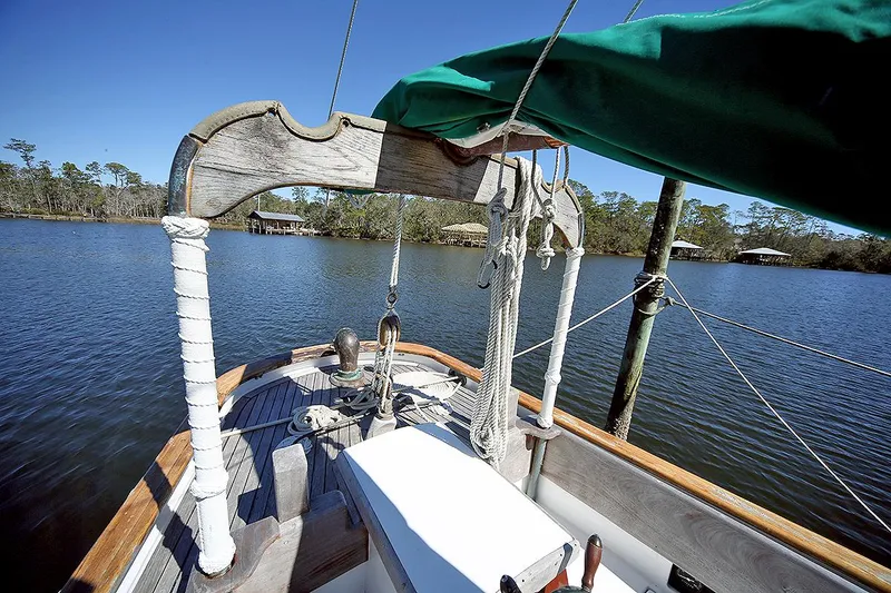 Slide: The Image of 1979 Custom Van Dyne Schooner on a calm lake with clear blue sky. - 17