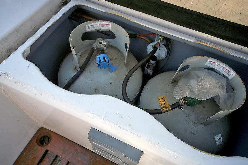 Slide: The Image of Propane tanks in storage compartment of 1979 Custom Van Dyne Schooner. - 27