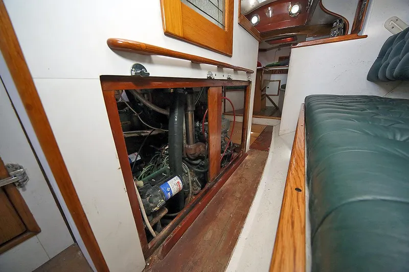 Slide: The Image of Engine compartment of a 1979 Custom Van Dyne Schooner with wooden interior. - 35