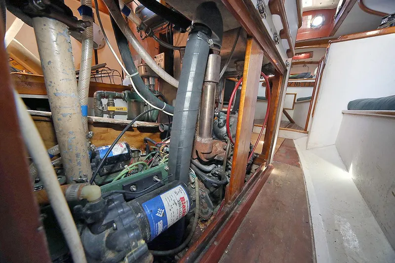 Slide: The Image of Engine room of a 1979 Custom Van Dyne Schooner with visible mechanical components. - 37