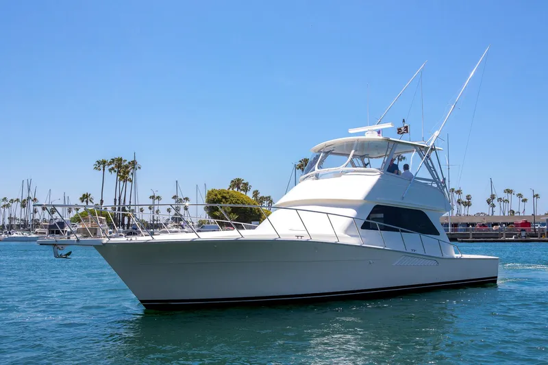 The Image of Viking 50 Convertible Sport Fisher 2000 yacht on clear blue water, sunny day. - 0