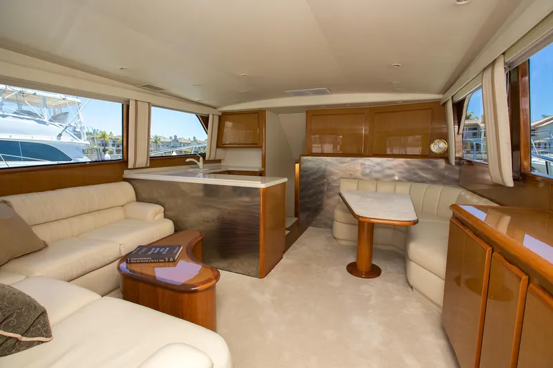 Slide: The Image of Luxurious interior of a 2000 Viking 50 Convertible Sport Fisher yacht with elegant seating and dining area. - 15