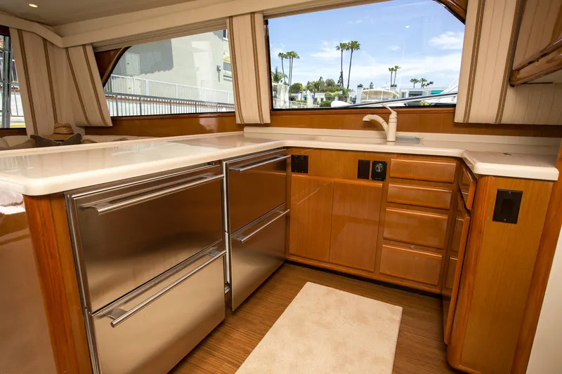 Slide: The Image of Luxurious kitchen interior of 2000 Viking 50 Convertible Sport Fisher yacht with stainless steel appliances. - 16