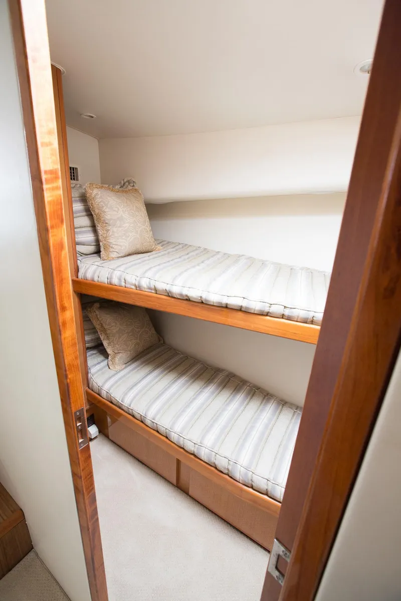 Slide: The Image of Bunk beds in 2000 Viking 50 Convertible Sport Fisher yacht cabin. - 21