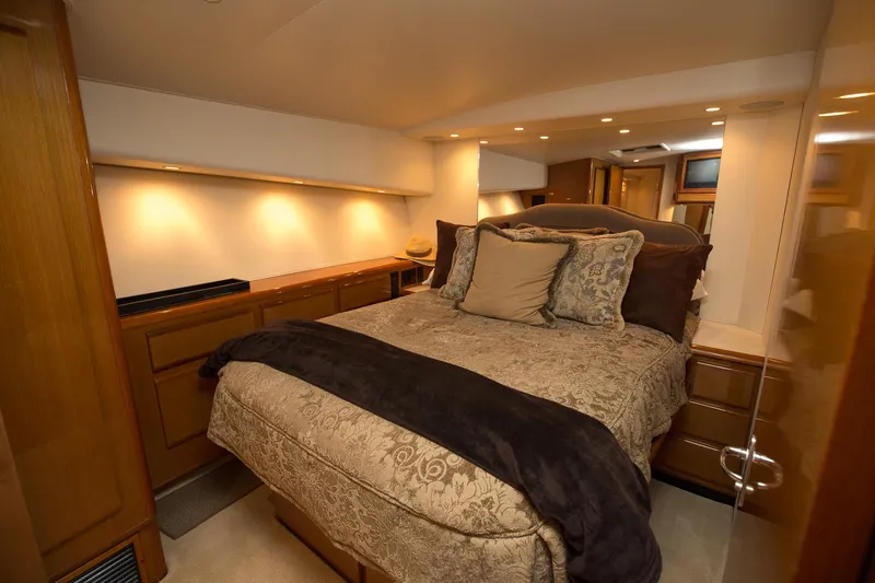 Slide: The Image of Luxurious bedroom interior of 2000 Viking 50 Convertible Sport Fisher yacht. - 23