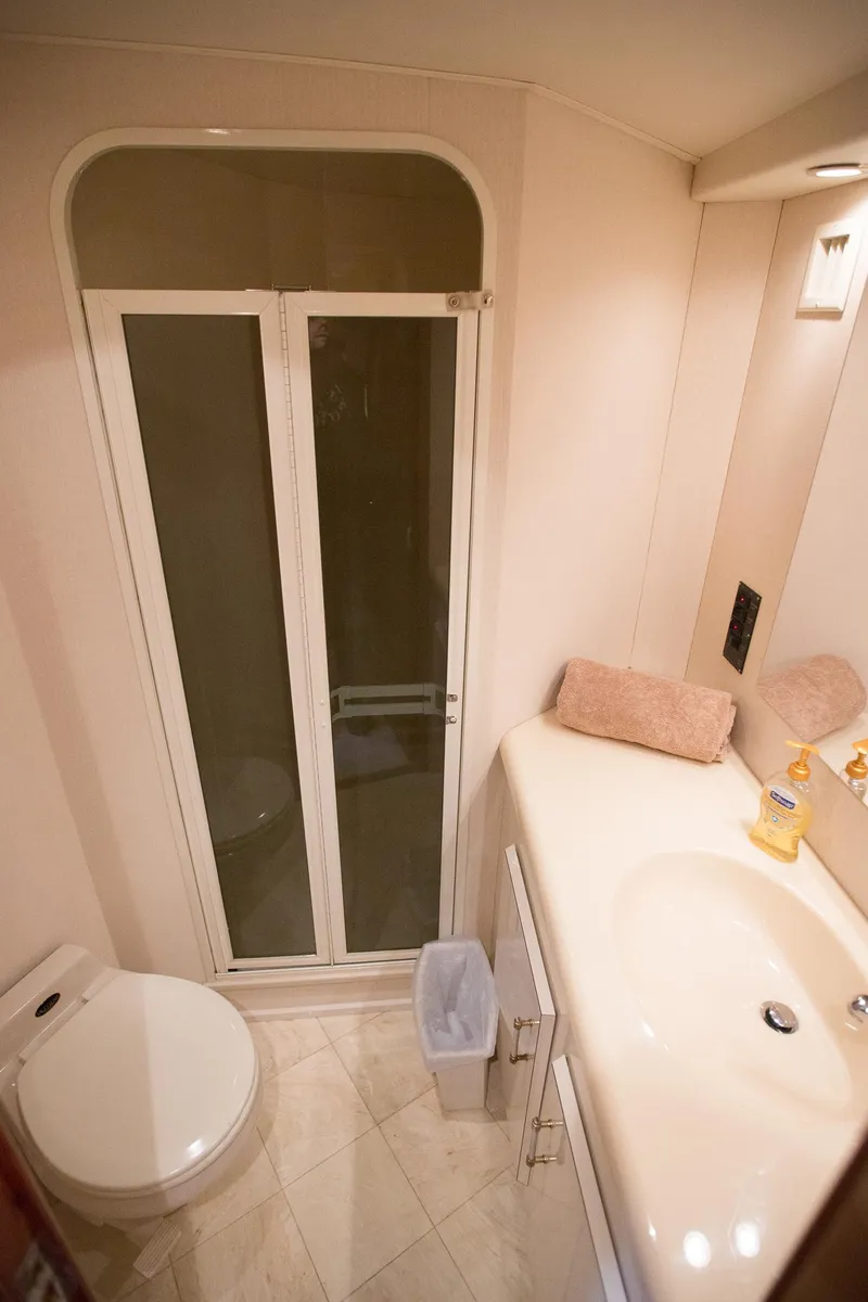 Slide: The Image of Bathroom interior of 2000 Viking 50 Convertible Sport Fisher yacht. - 24