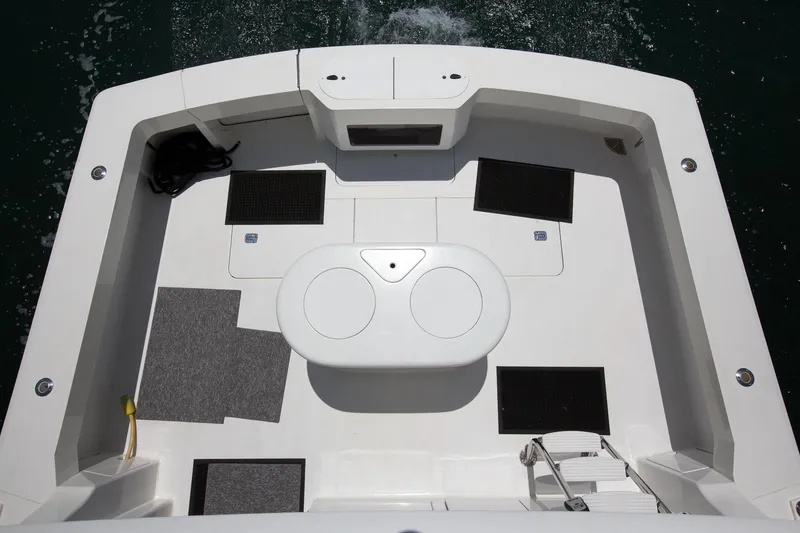 Slide: The Image of Cockpit view of 2000 Viking 50 Convertible Sport Fisher boat, featuring spacious deck layout. - 35