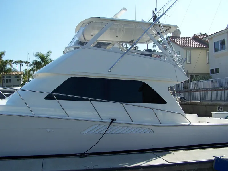 Slide: The Image of 2000 Viking 50 Convertible Sport Fisher yacht docked at marina. - 6