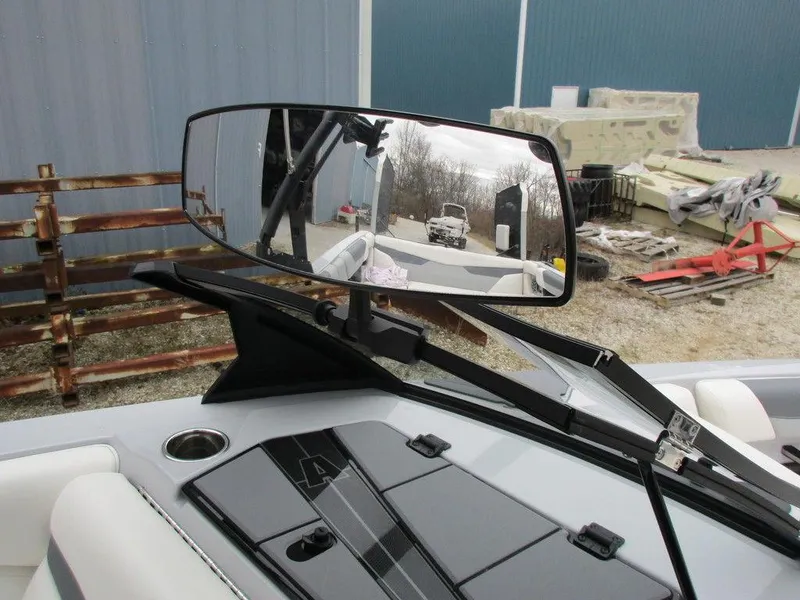 Slide: The Image of 2022 Axis A24 boat dashboard with rearview mirror and outdoor reflection. - 12