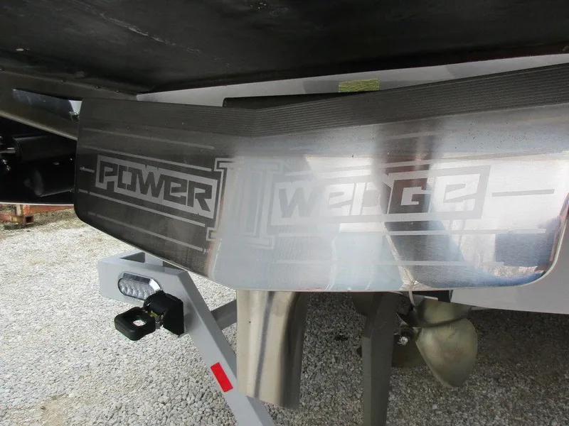 Slide: The Image of 2022 Axis A24 boat with Power Wedge feature, showcasing propeller and trailer details. - 21