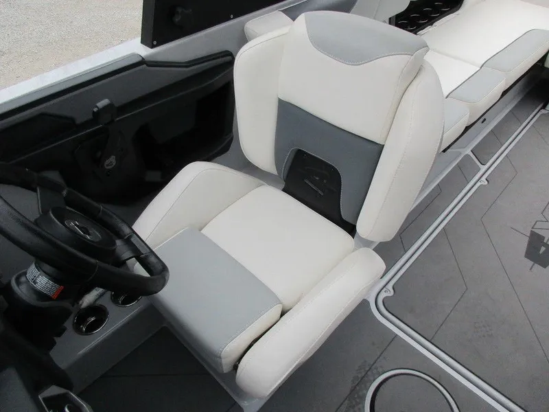 Slide: The Image of 2022 Axis A24 boat interior with white and gray seating and steering wheel. - 7