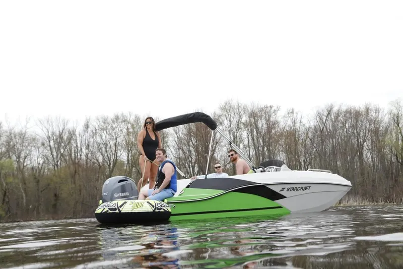 Slide: The Image of 2024 Starcraft 191 SVX boat with people enjoying water activities. - 1