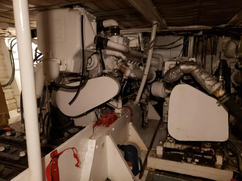 Slide: The Image of Engine room of a 1964 Chris-Craft Constellation boat, showcasing mechanical components. - 35