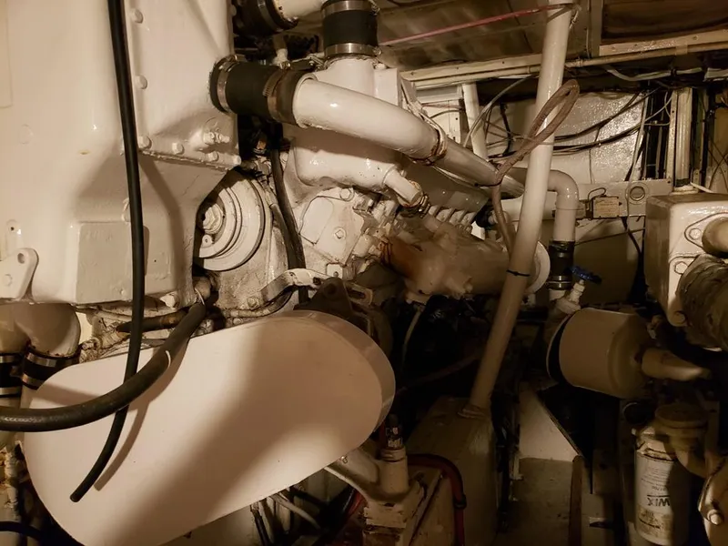 Slide: The Image of Engine room of a 1964 Chris-Craft Constellation boat, showcasing mechanical components. - 38