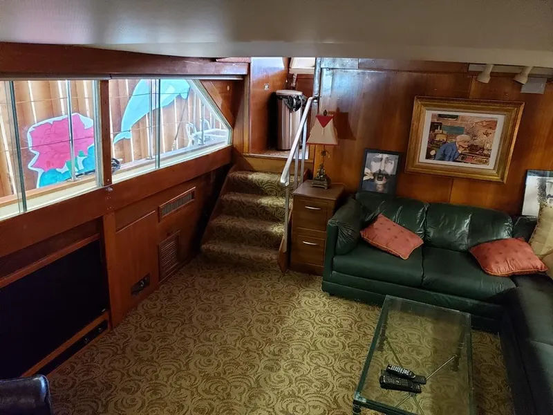 Slide: The Image of Interior of a 1964 Chris-Craft Constellation yacht with vintage decor and green leather seating. - 41