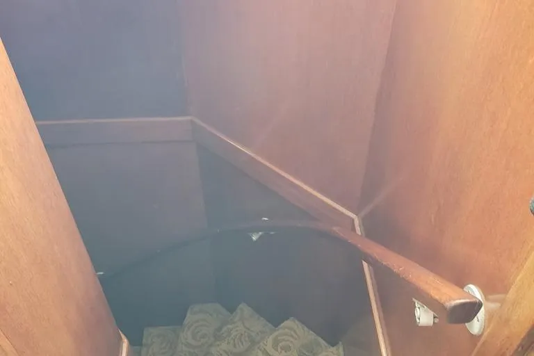 Slide: The Image of Wooden staircase inside a 1964 Chris-Craft Constellation boat. - 42