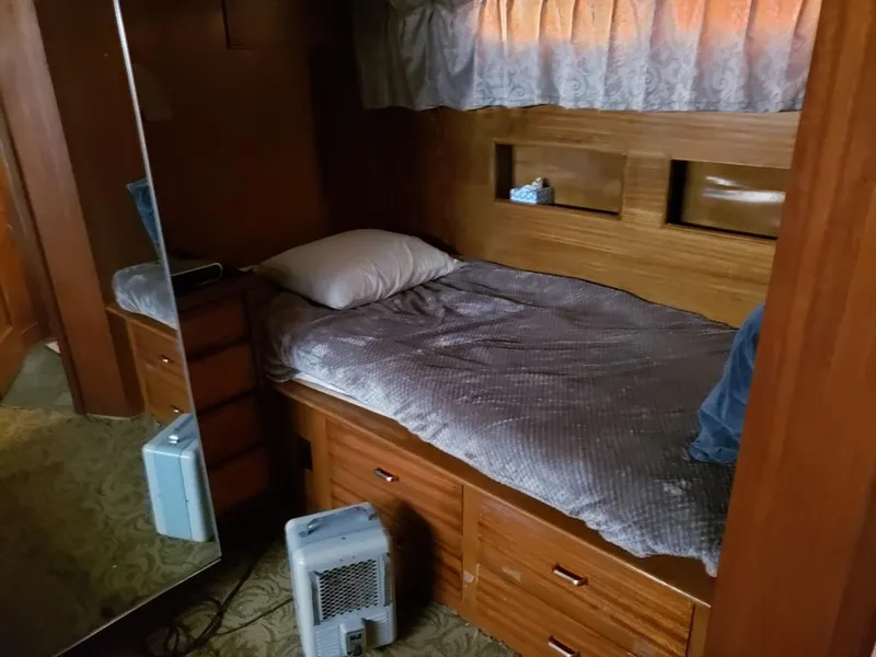 Slide: The Image of Cozy cabin interior of 1964 Chris-Craft Constellation with bed, mirror, and heater. - 26