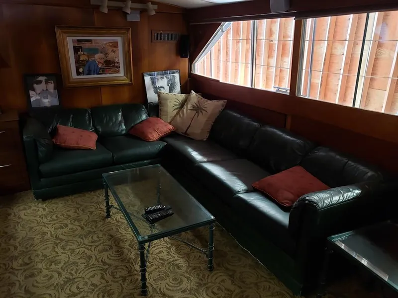 Slide: The Image of Luxurious 1964 Chris-Craft Constellation yacht interior with leather sofas and elegant decor. - 30