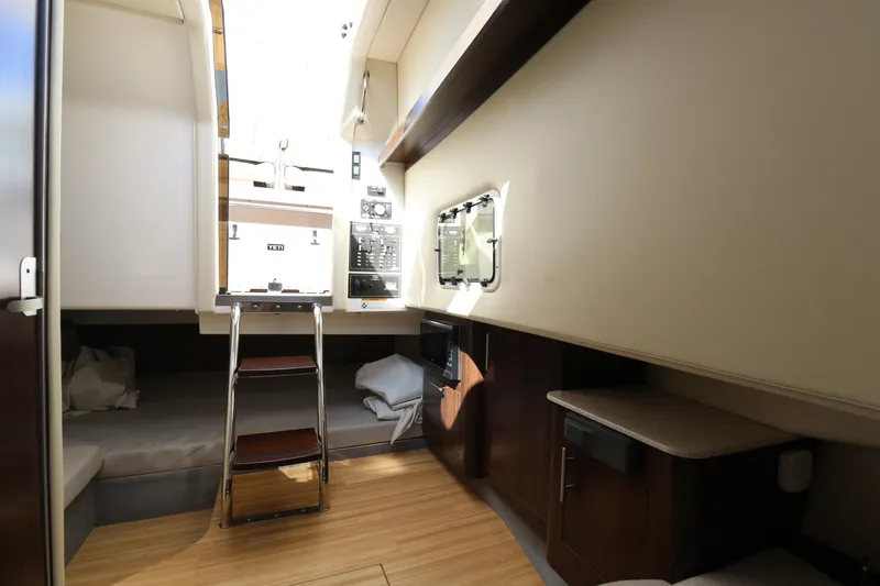 Slide: The Image of 2019 Regal 33 SAV cabin interior with modern design and wooden finishes. - 21