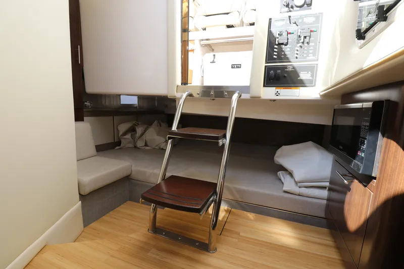 Slide: The Image of 2019 Regal 33 SAV cabin interior with ladder, seating, and control panel. - 22