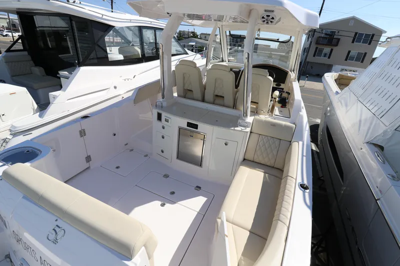 Slide: The Image of 2019 Regal 33 SAV boat with spacious seating and modern amenities. - 9