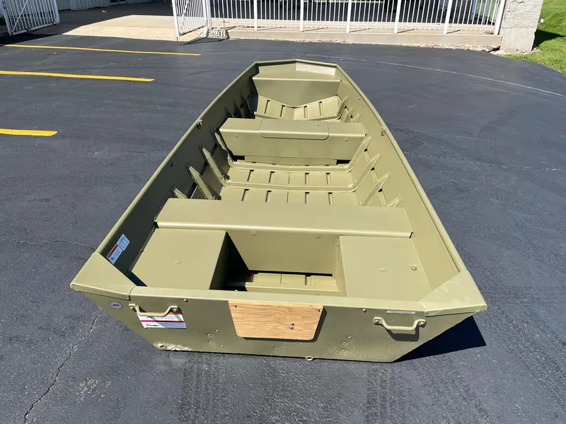 Slide: The Image of 2024 Lowe L1440M aluminum jon boat on pavement. - 2