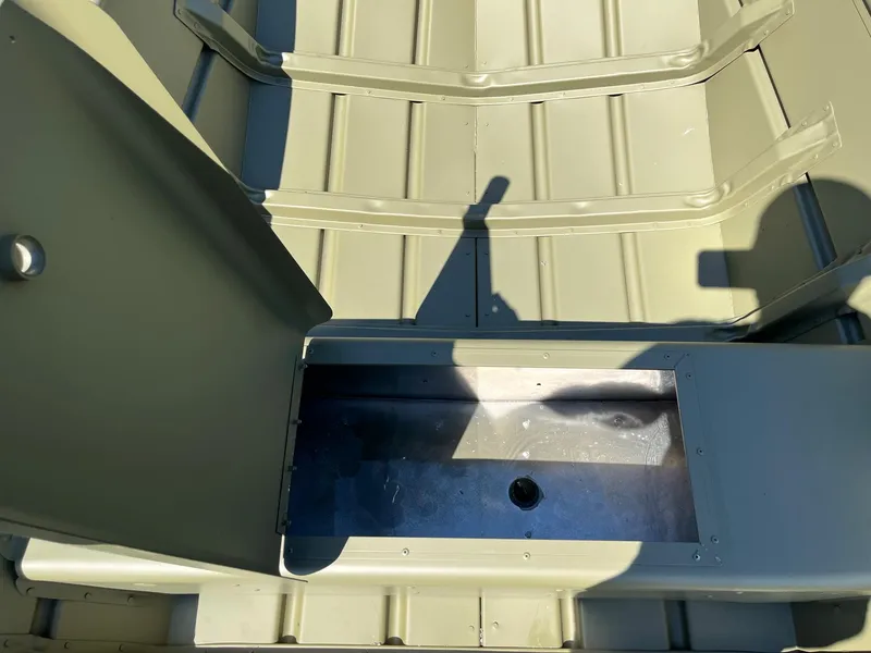 Slide: The Image of 2024 Lowe L1440M boat interior with storage compartment. - 5