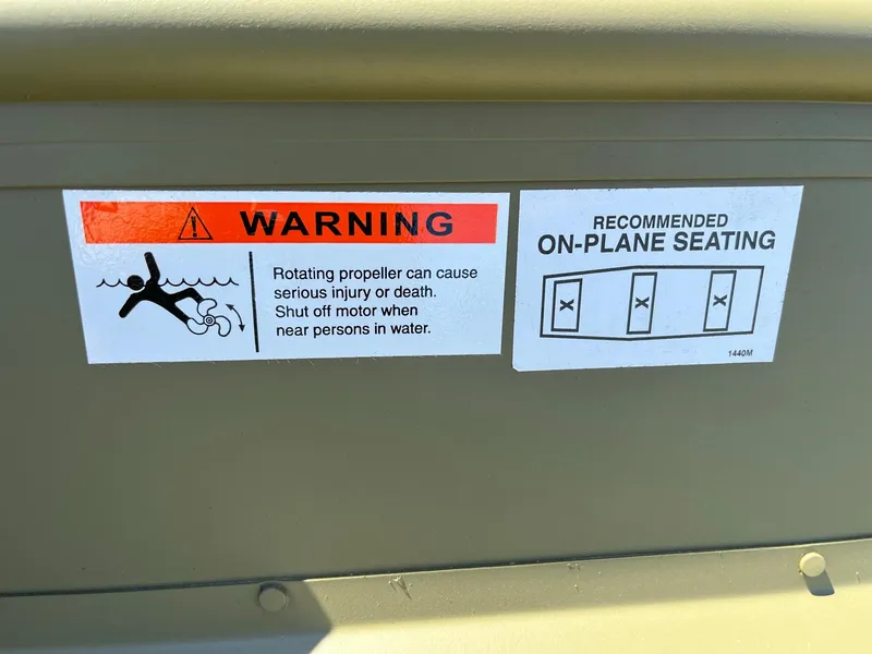 Slide: The Image of 2024 Lowe L1440M boat warning and seating recommendation labels - 6