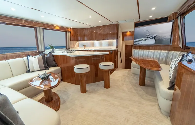 Slide: The Image of Luxurious interior of 2025 Viking 54 yacht with modern furnishings and ocean view. - 11