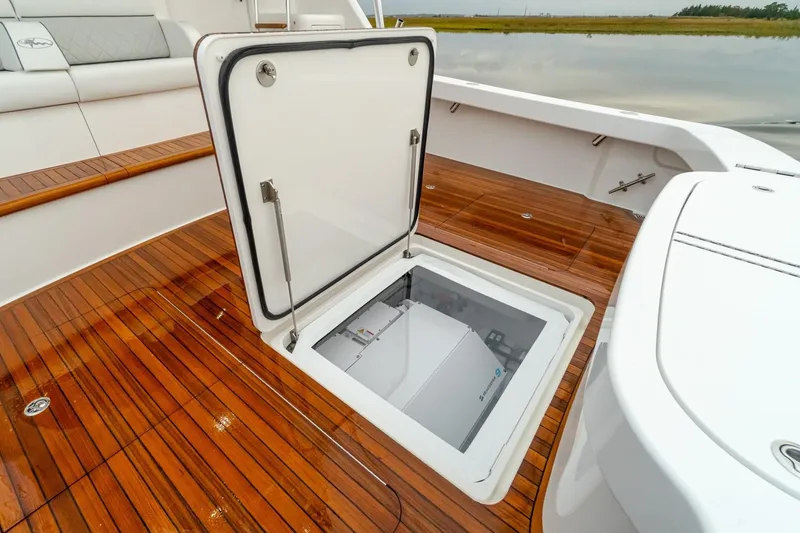 Slide: The Image of Open hatch on the deck of a 2025 Viking 54 yacht. - 6