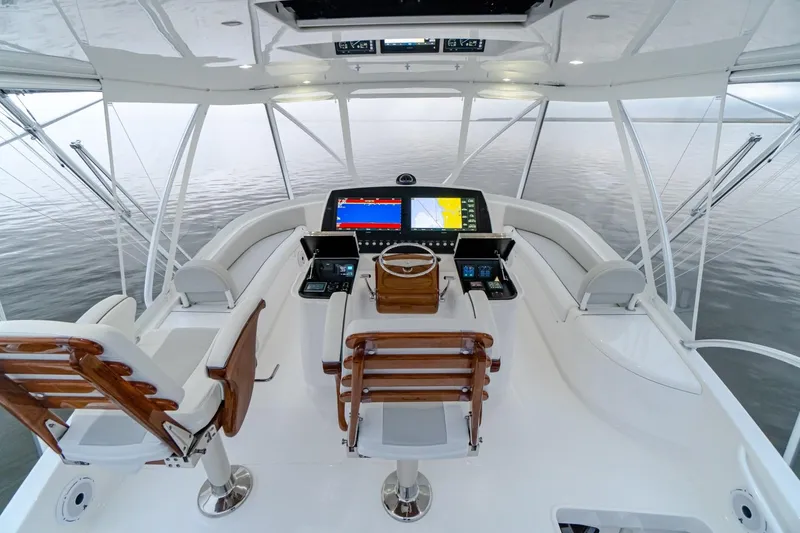 Slide: The Image of Modern helm station of 2025 Viking 54 yacht with advanced navigation systems. - 9