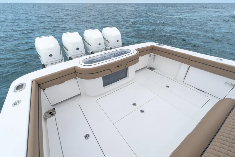 Slide: The Image of 2025 Valhalla Boatworks 41 model with quad outboard engines on open water. - 3