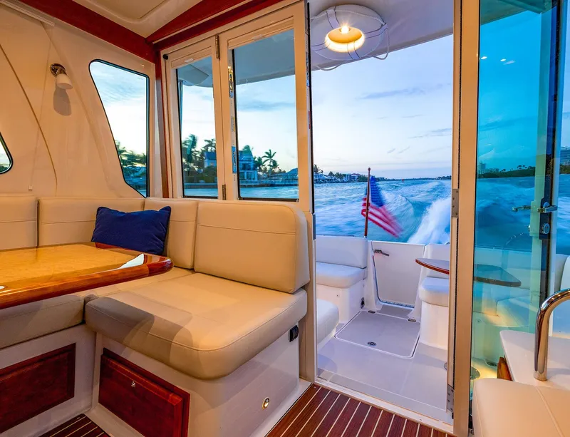 Slide: The Image of Interior of 2025 Back Cove 372 yacht with ocean view and American flag. - 10