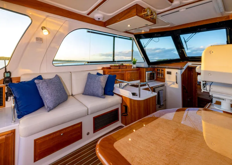 Slide: The Image of Interior of 2025 Back Cove 372 yacht with plush seating and modern amenities. - 13