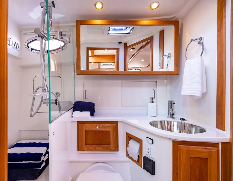 Slide: The Image of Luxurious bathroom in 2025 Back Cove 372 yacht with modern fixtures and wooden accents. - 20