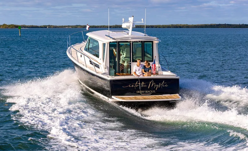 Slide: The Image of 2025 Back Cove 372 cruising on open water with passengers. - 5