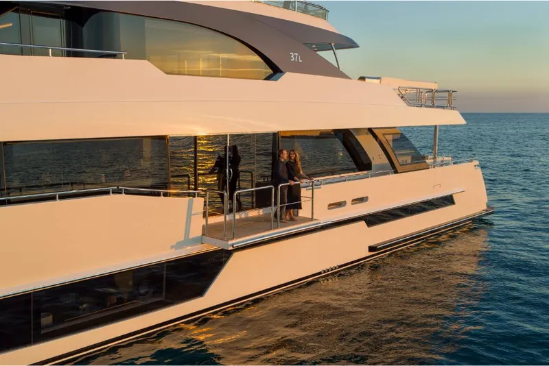 Slide: The Image of Luxury 2023 Ocean Alexander 37L yacht cruising at sunset. - 10