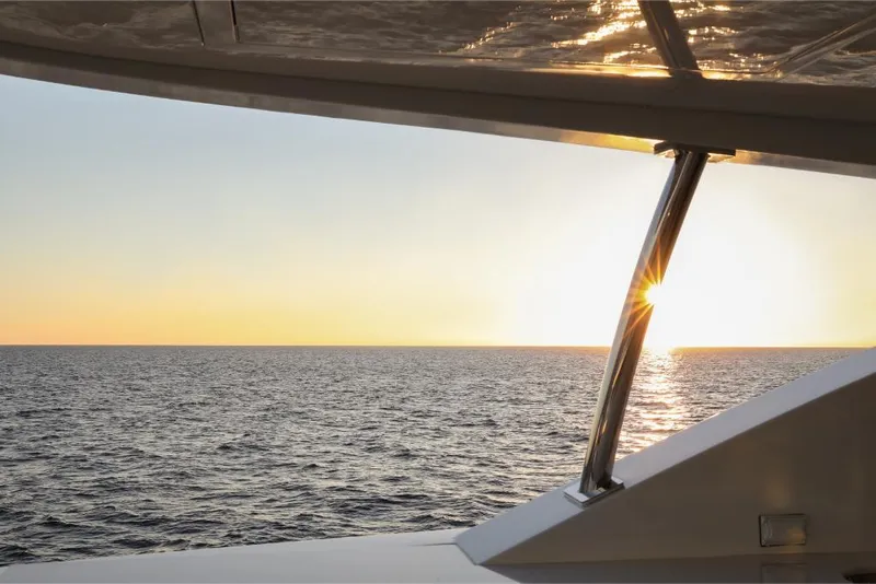 Slide: The Image of View of the ocean at sunset from Ocean Alexander 37L yacht, 2023 model. - 12